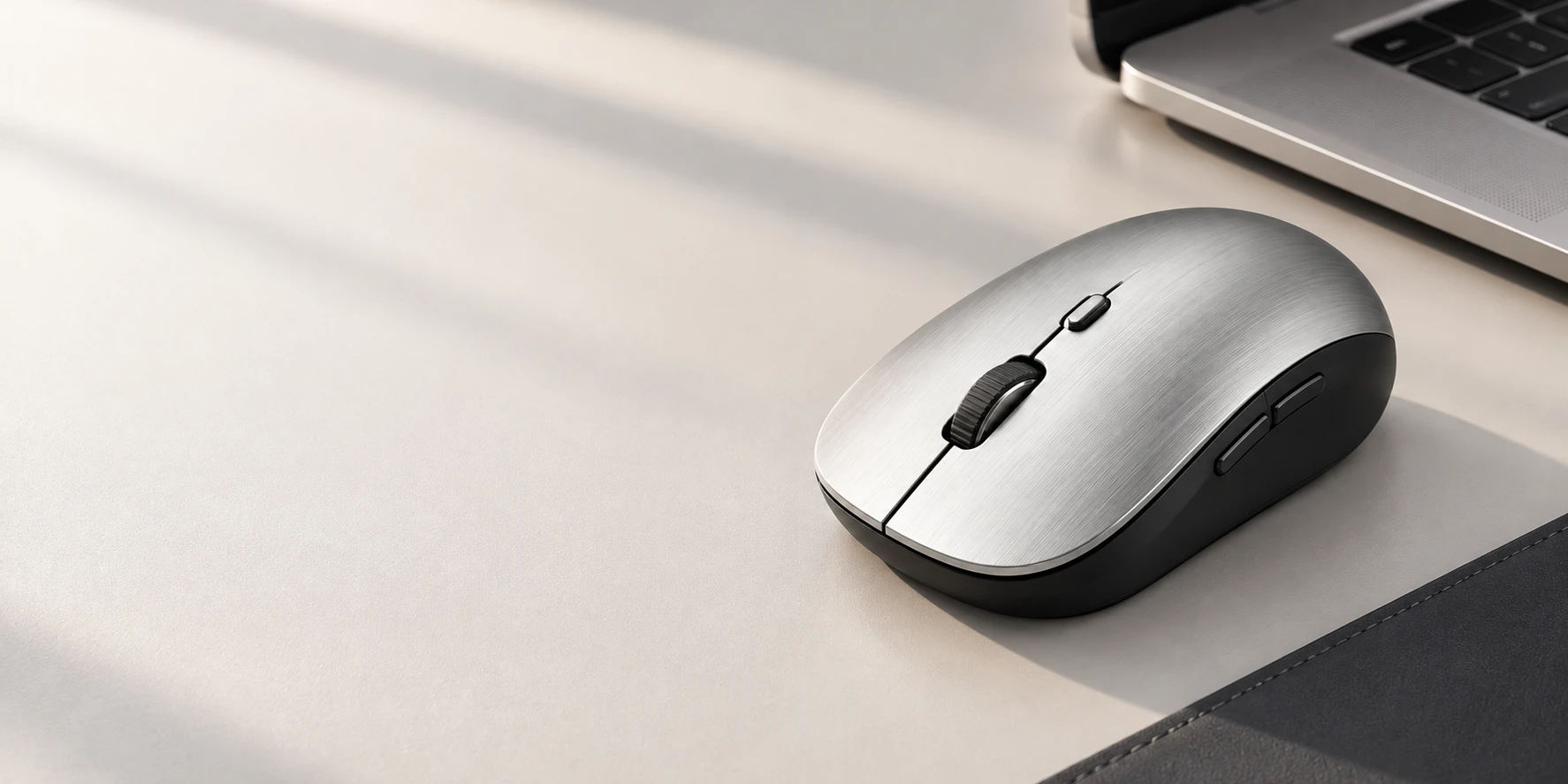 A silver Ikonystic mouse on a considered desktop